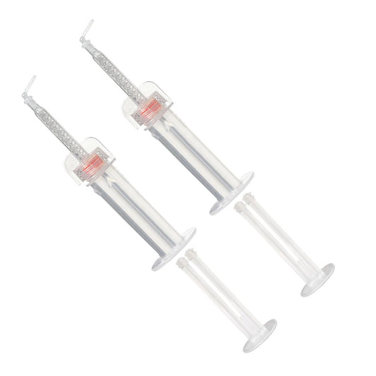 Two empty, ready-to-fill Mojo Syringes. At 2ccs, the syringes are small, ergonomic, and use impression material more efficiently than bulky guns. Less waste means more cost savings for dentists.